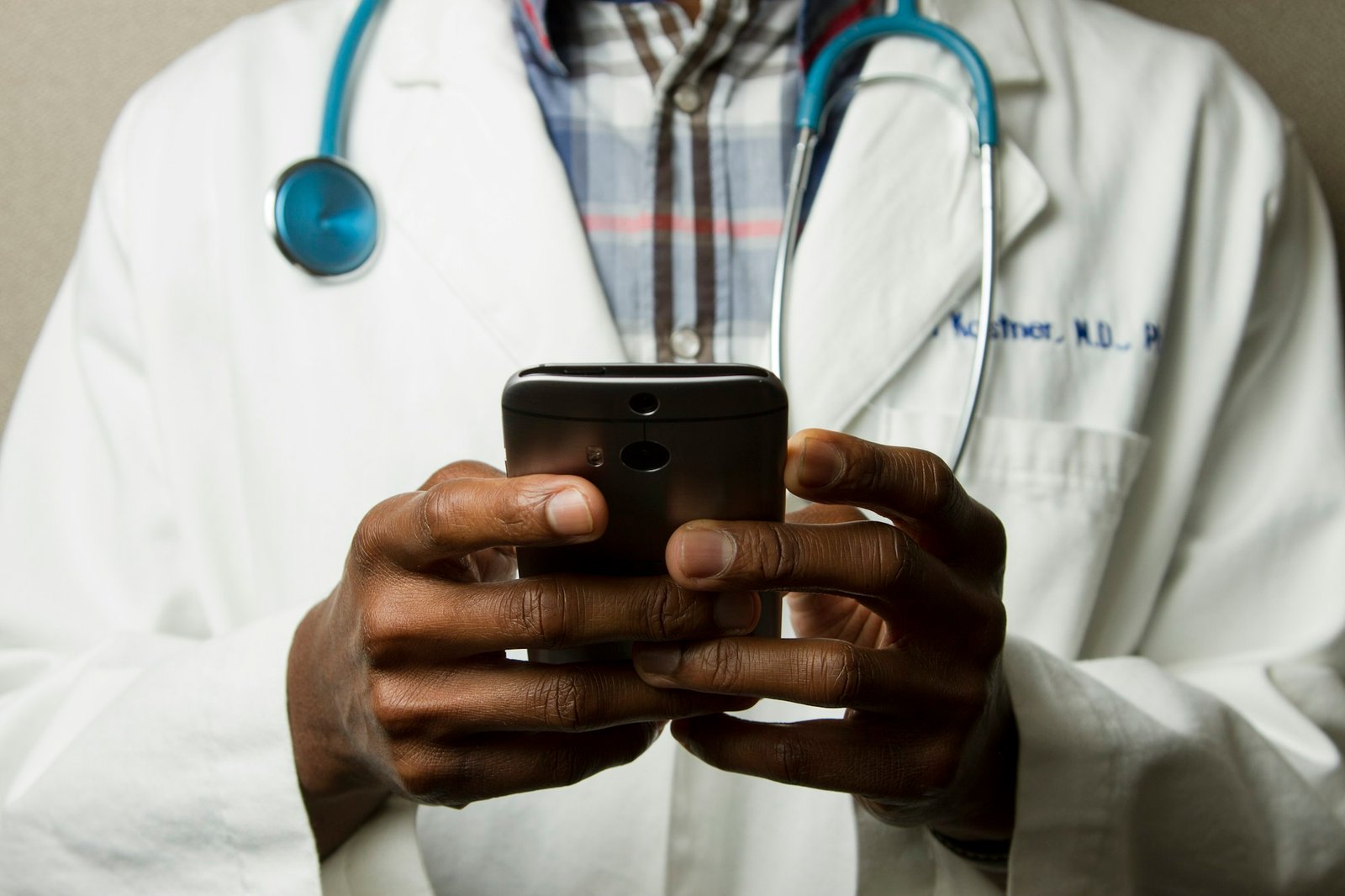 A healthcare professional using a smartphone to connect with care services