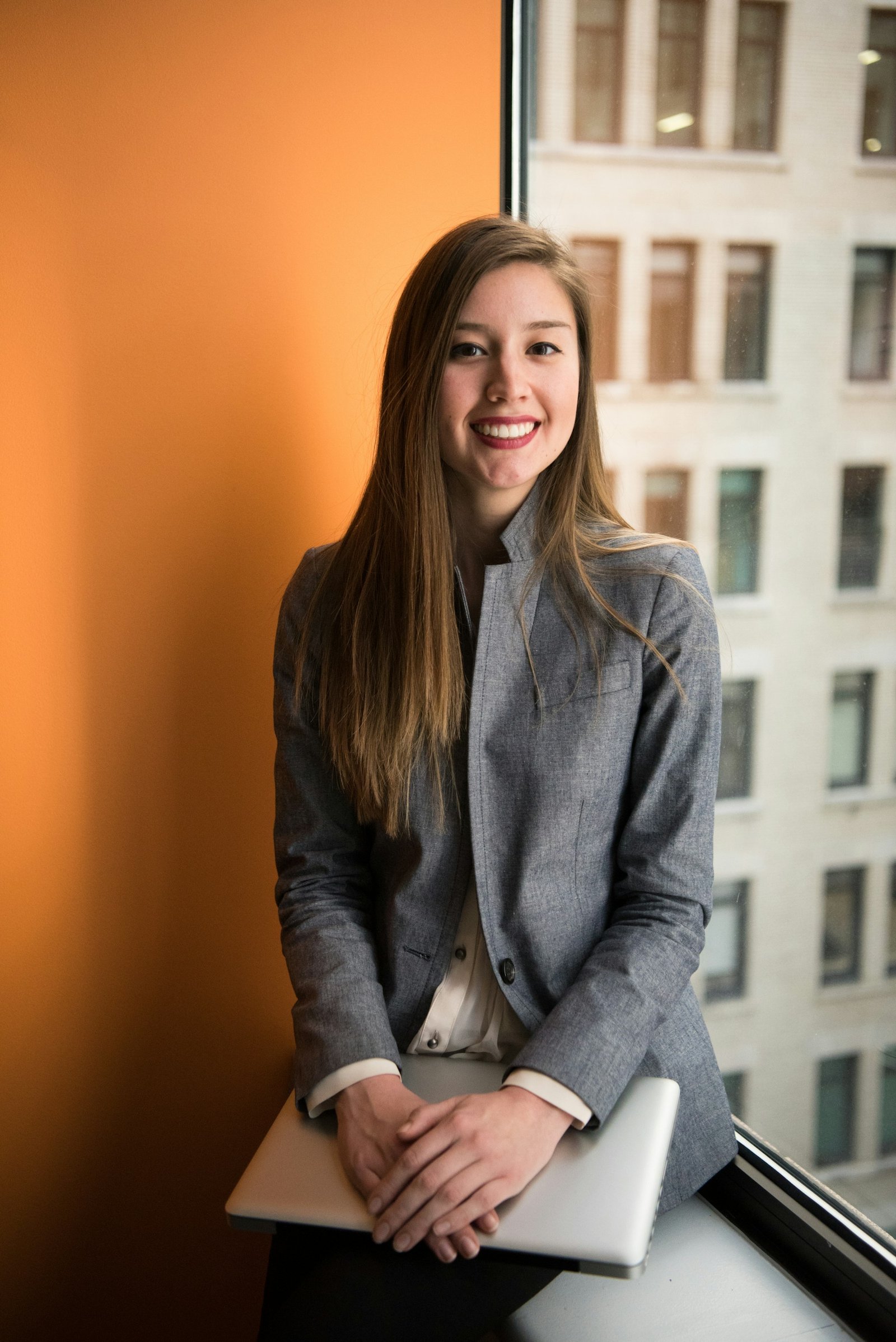 A smiling professional looking ahead with confidence