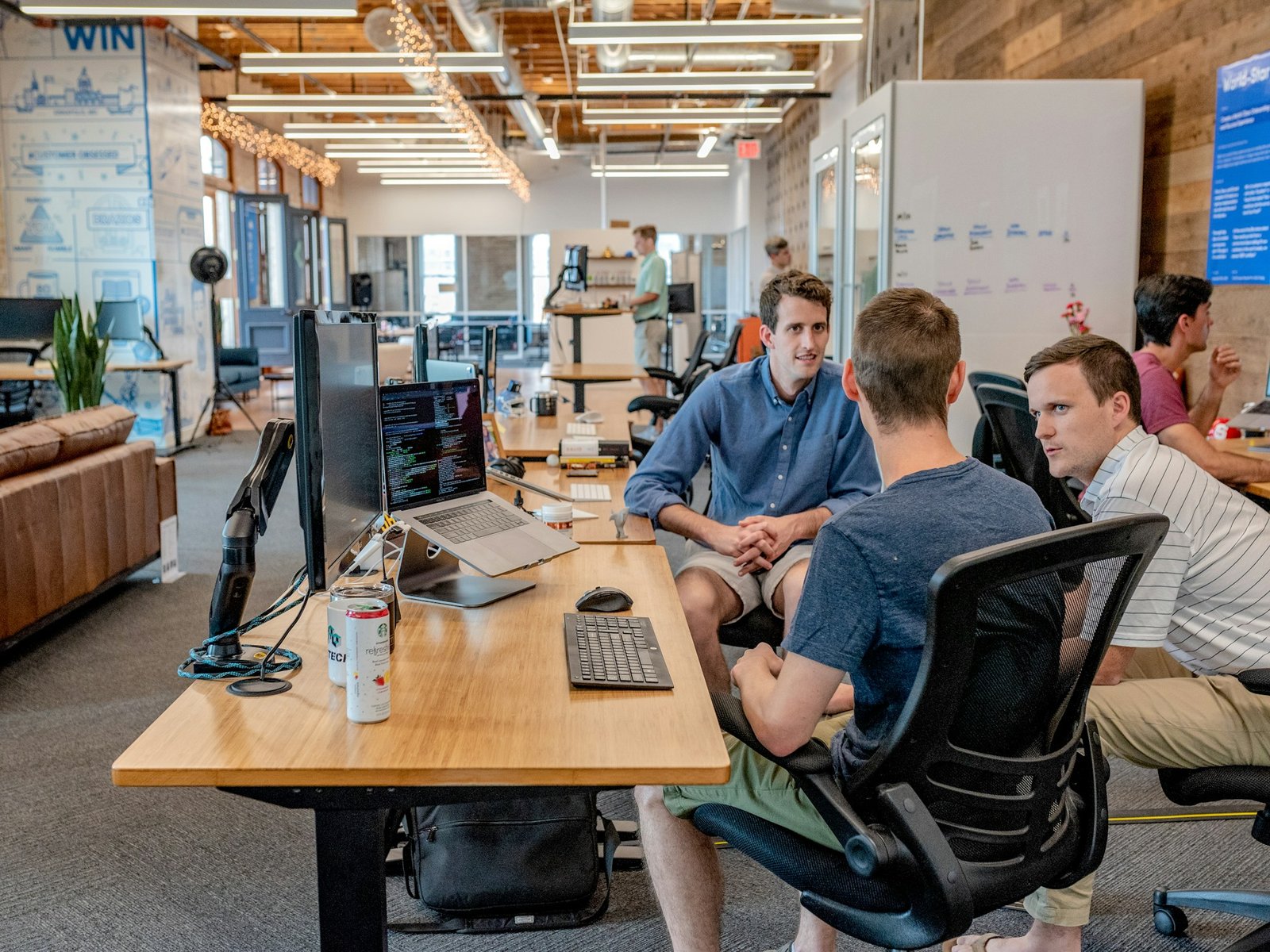 People working through a shared challenge around a table